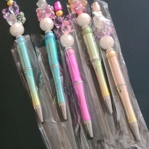 Three Decorated beaded pens.
